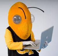 Buzz holding laptop